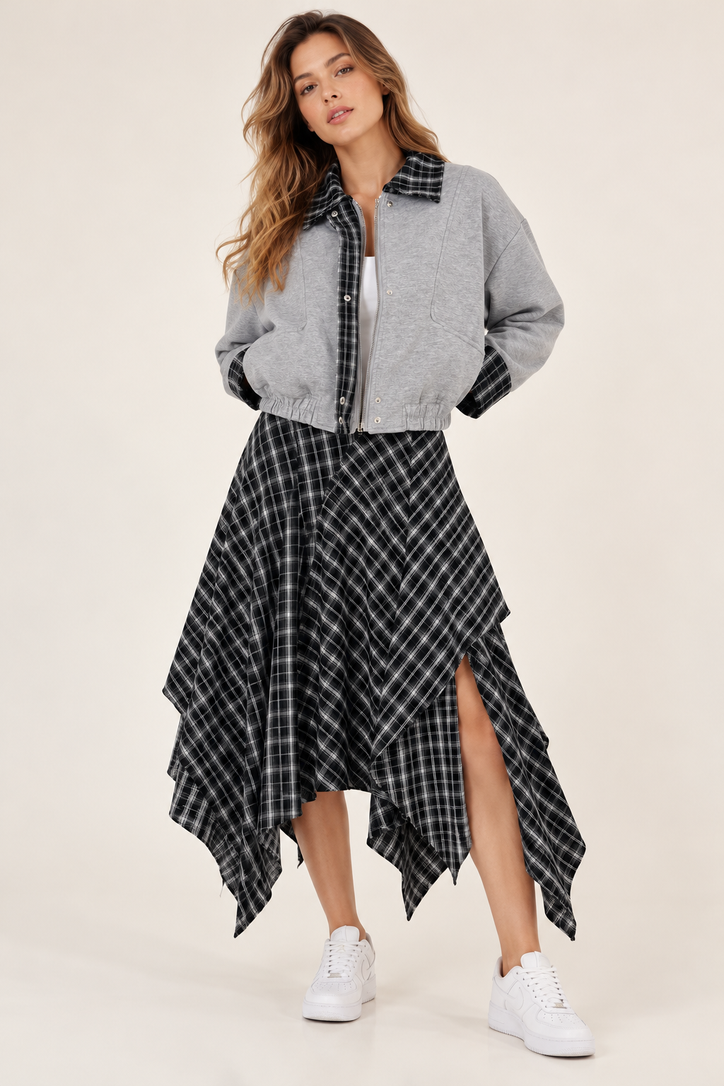 A ruffled skirt with a black and white checkered pattern and a side slit.