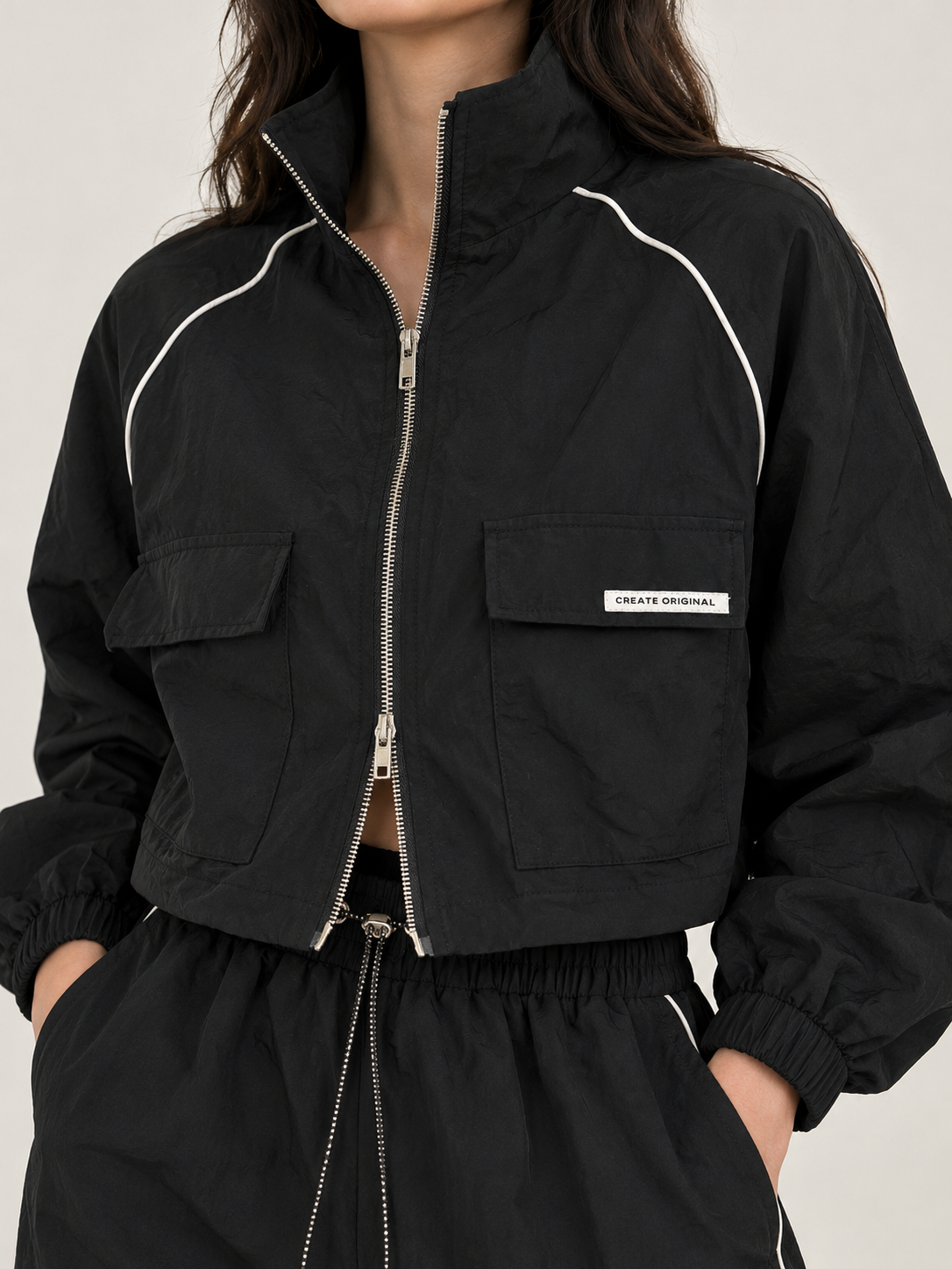 Black waterproof sweatshirt with white stripe and front pocket