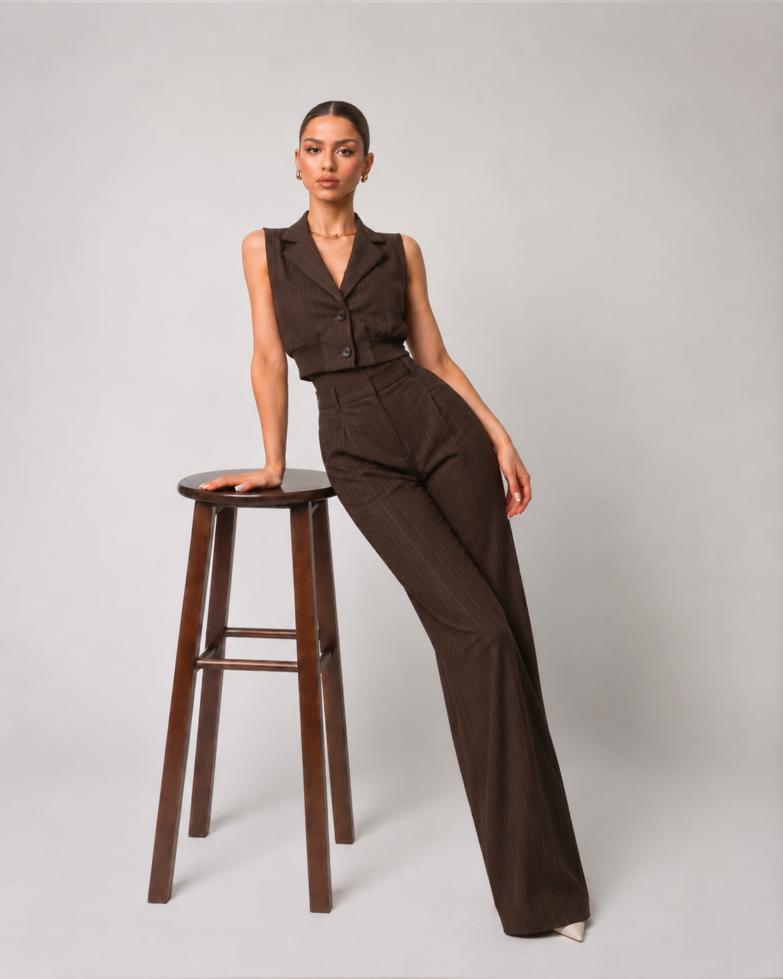 Brown striped button-up vest with a V-neck and fitted waist