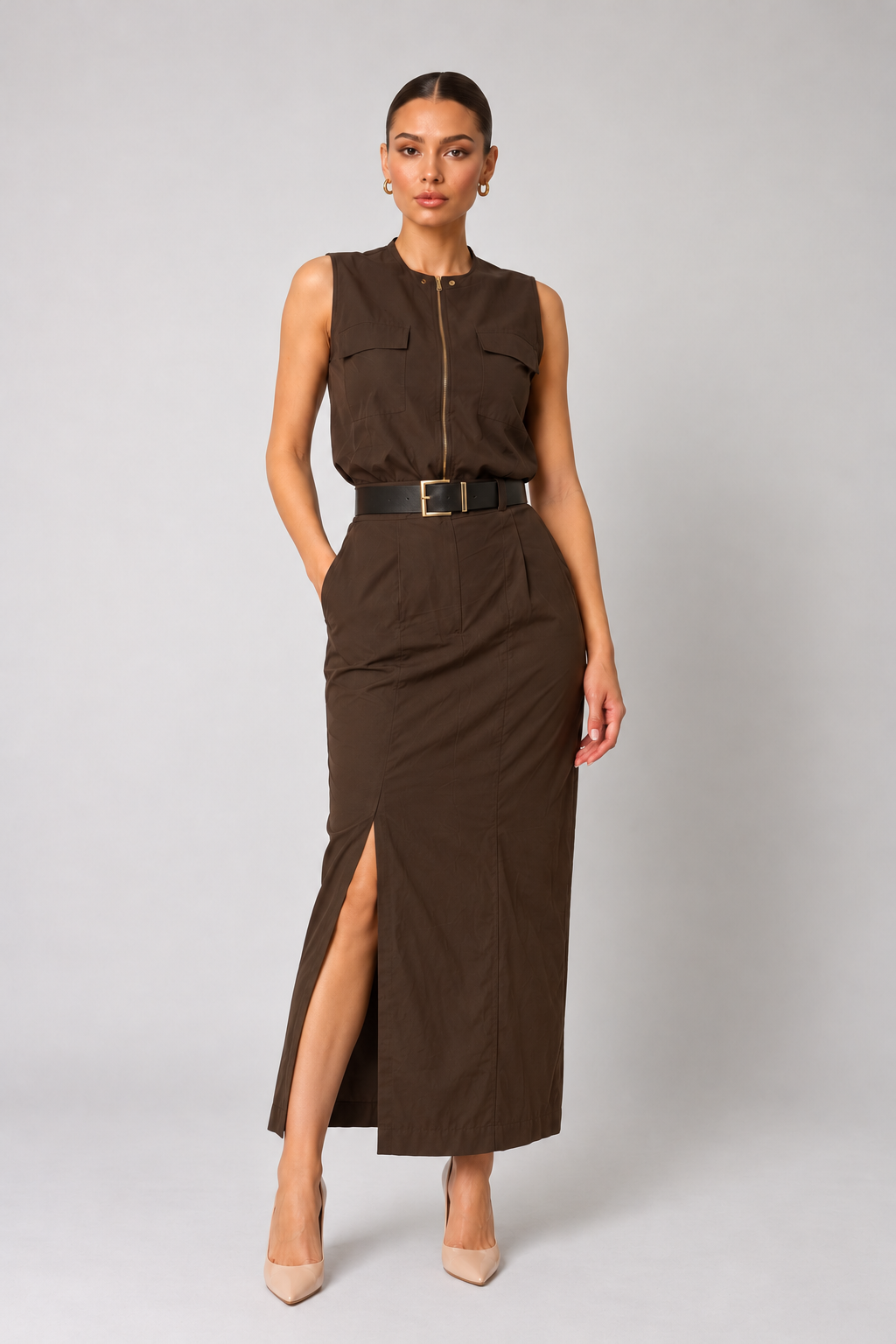 Long brown skirt with a leg slit and a wide belt with a gold buckle.