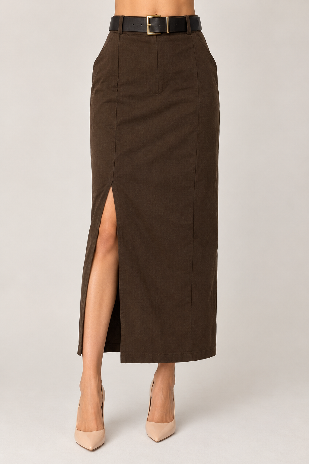 Long brown skirt with a leg slit and a wide belt with a gold buckle.