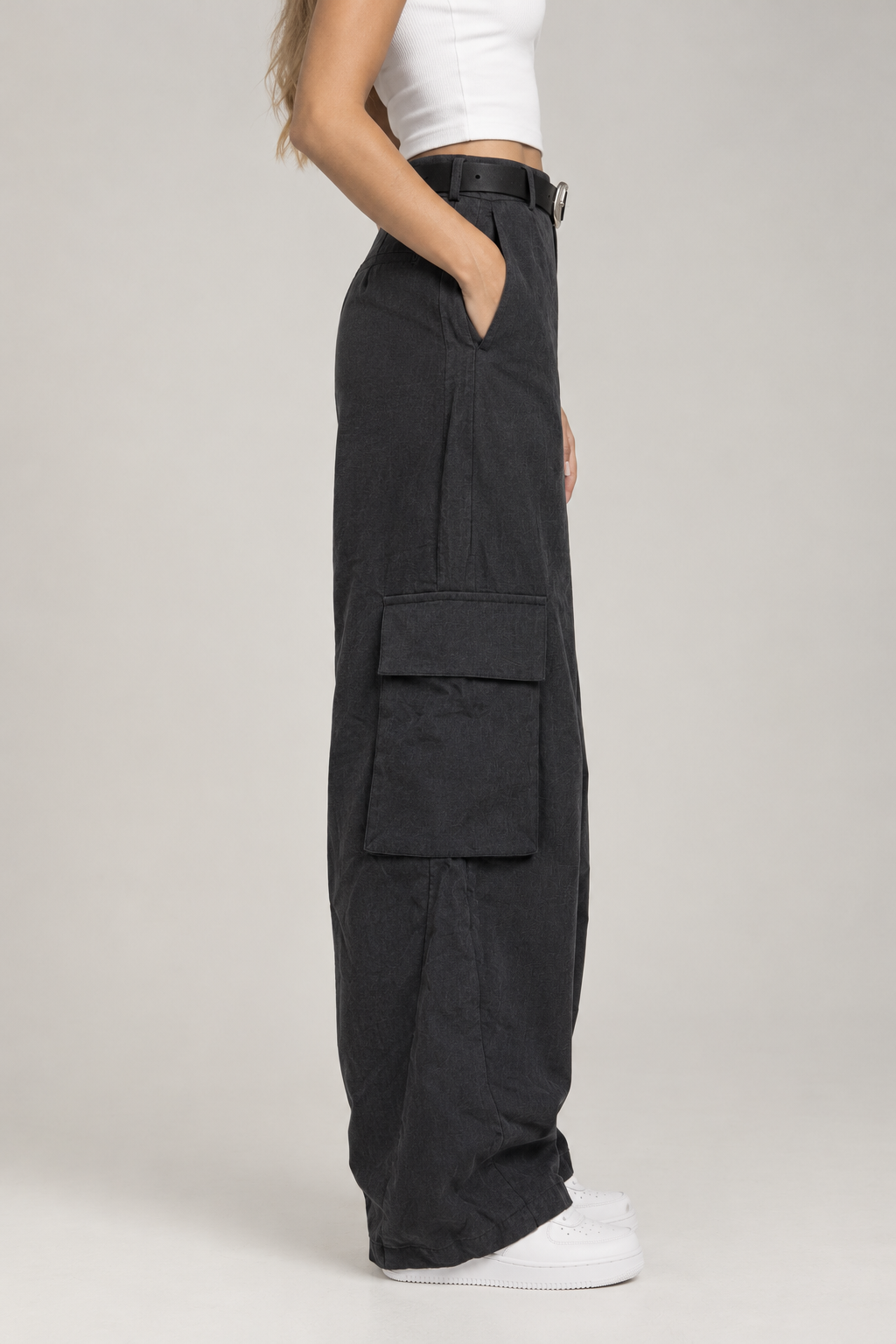 Charcoal cargo pants with a silver buckle belt