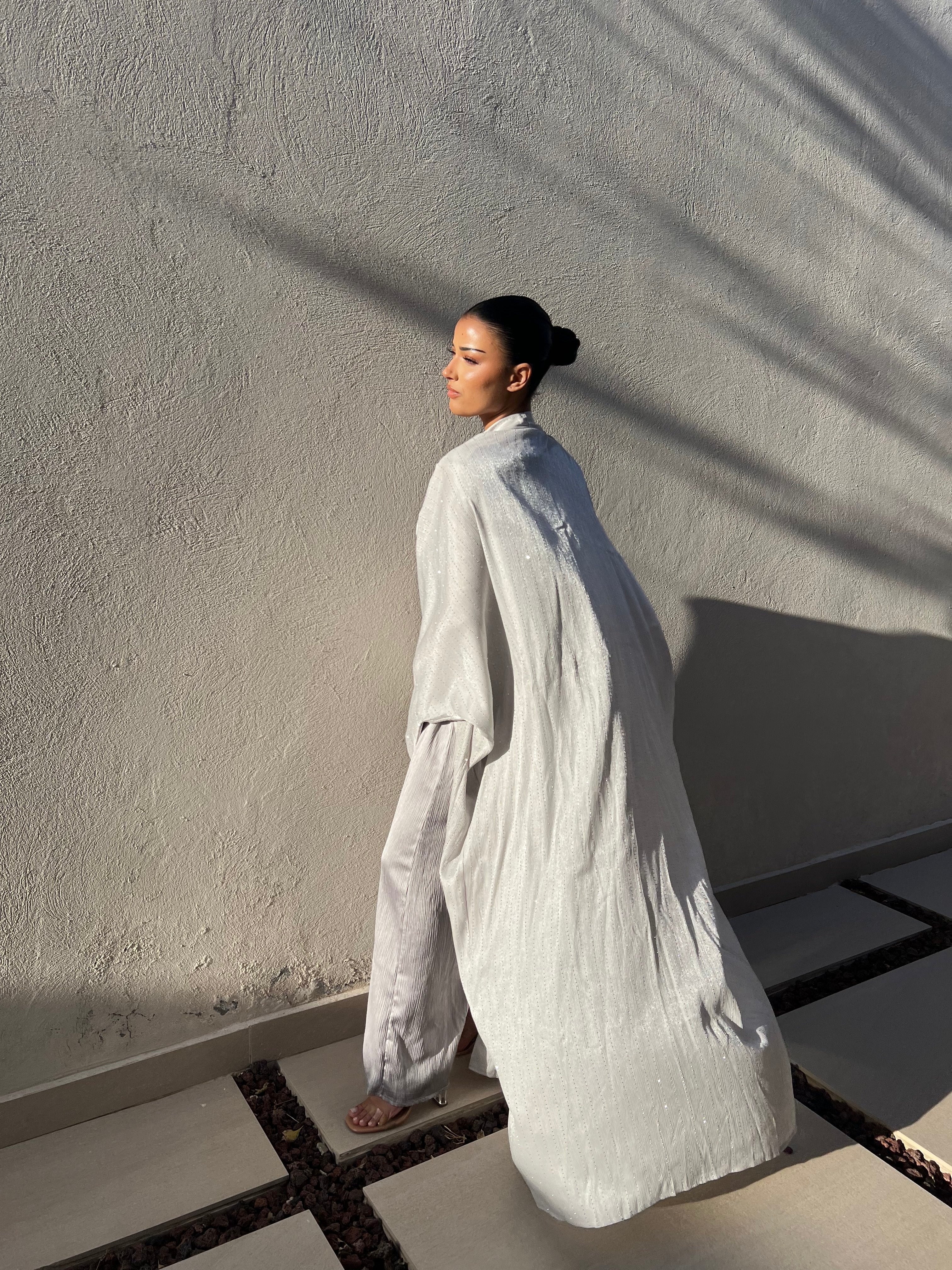 Abaya with a gray dress studded with rhinestones