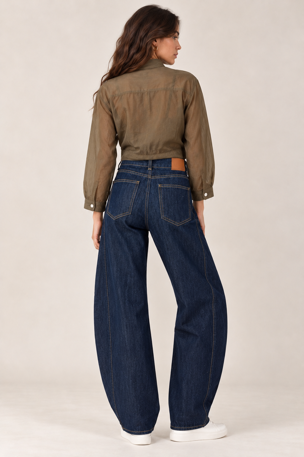 Navy blue balloon jeans with a curved side stripe