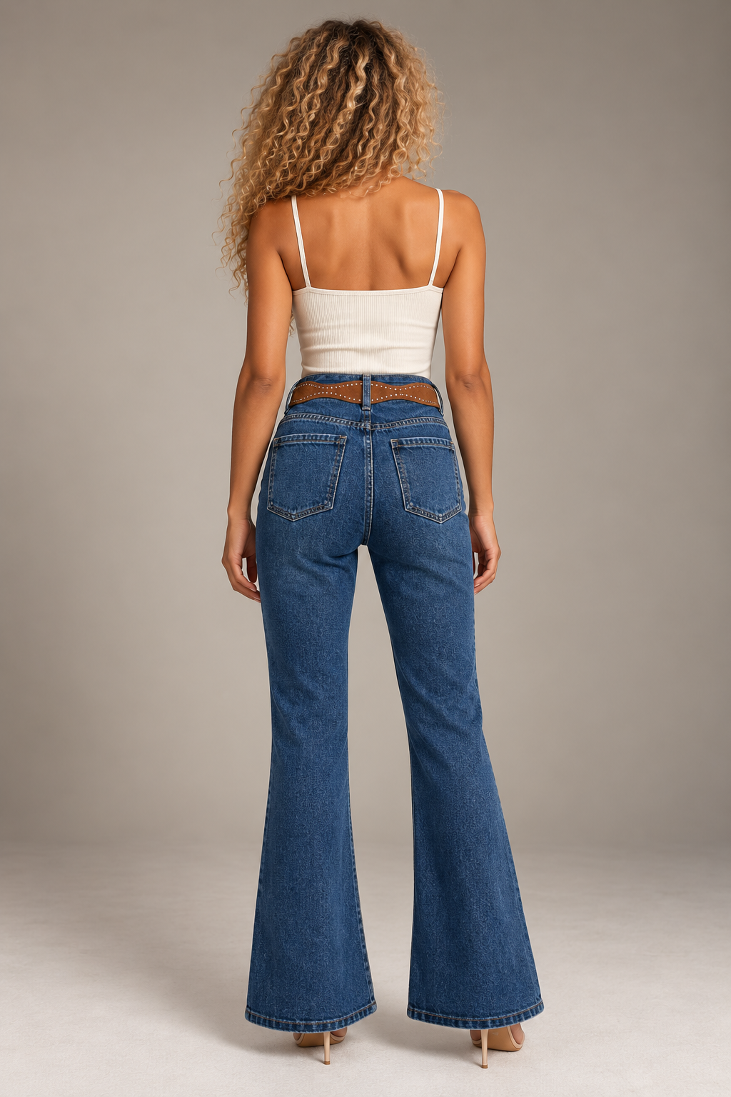 Blue jeans with a honey-colored belt