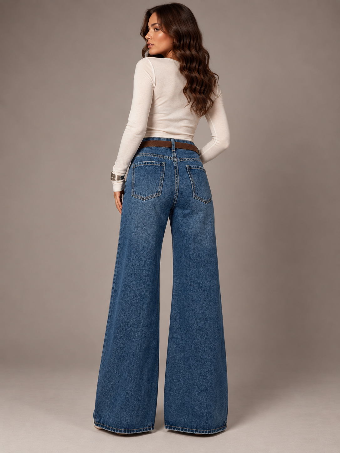 Blue wide-leg jeans with a brown belt and a wallet