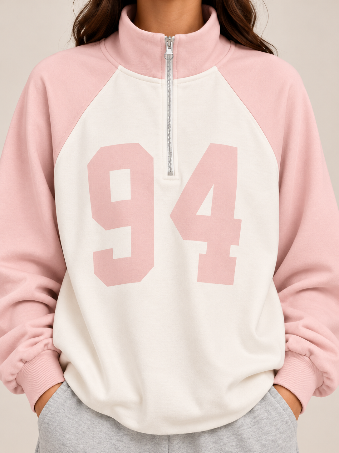 Sweater with a zippered collar, colored sleeves, and a white chest with the number "94"