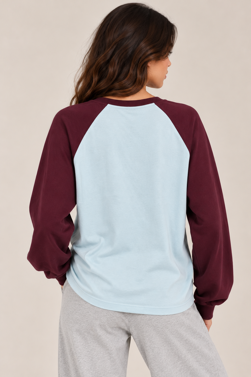 A blouse with burgundy sleeves and a blue top (words)