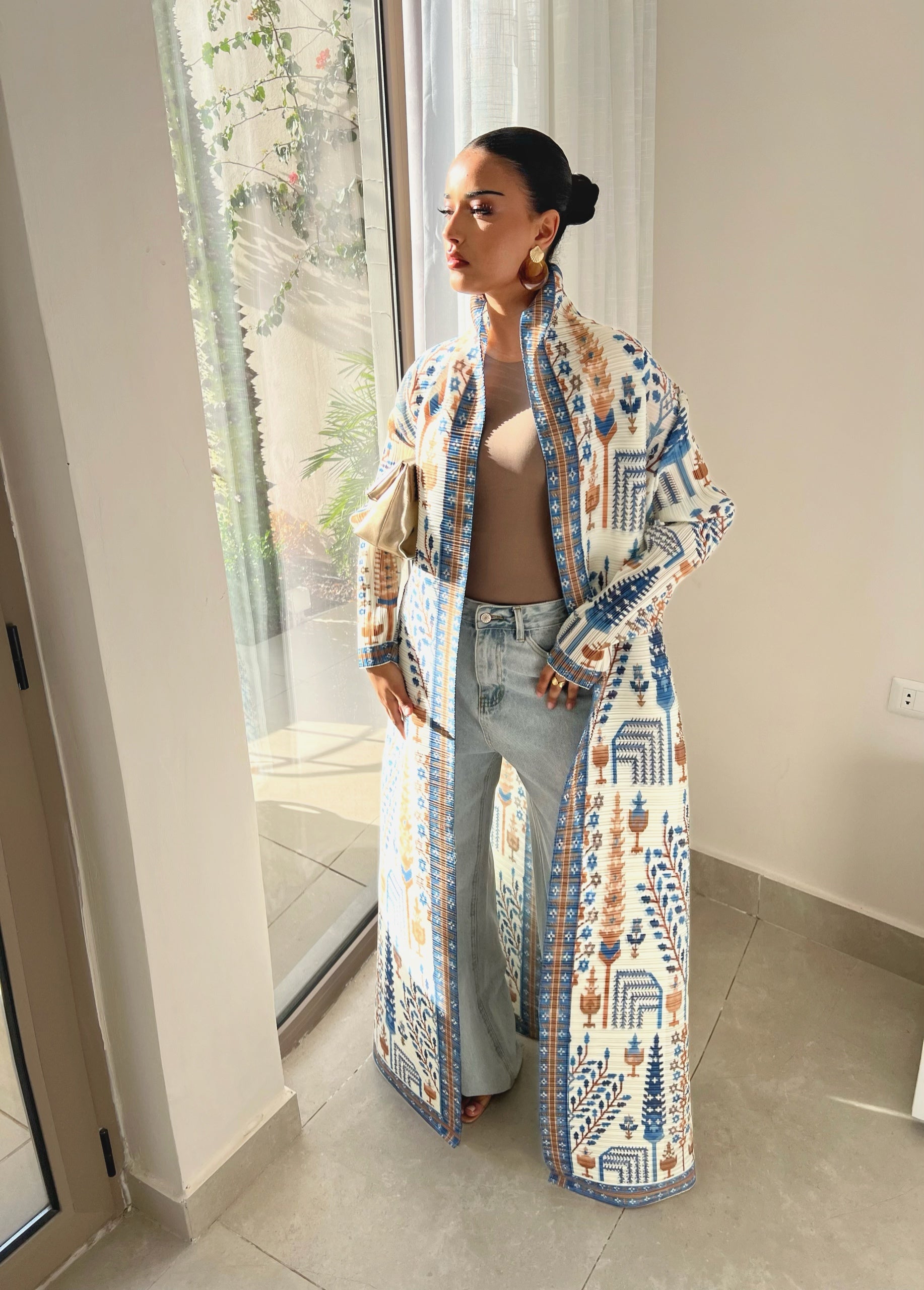 Blue and brown patterned abaya with a tied waist