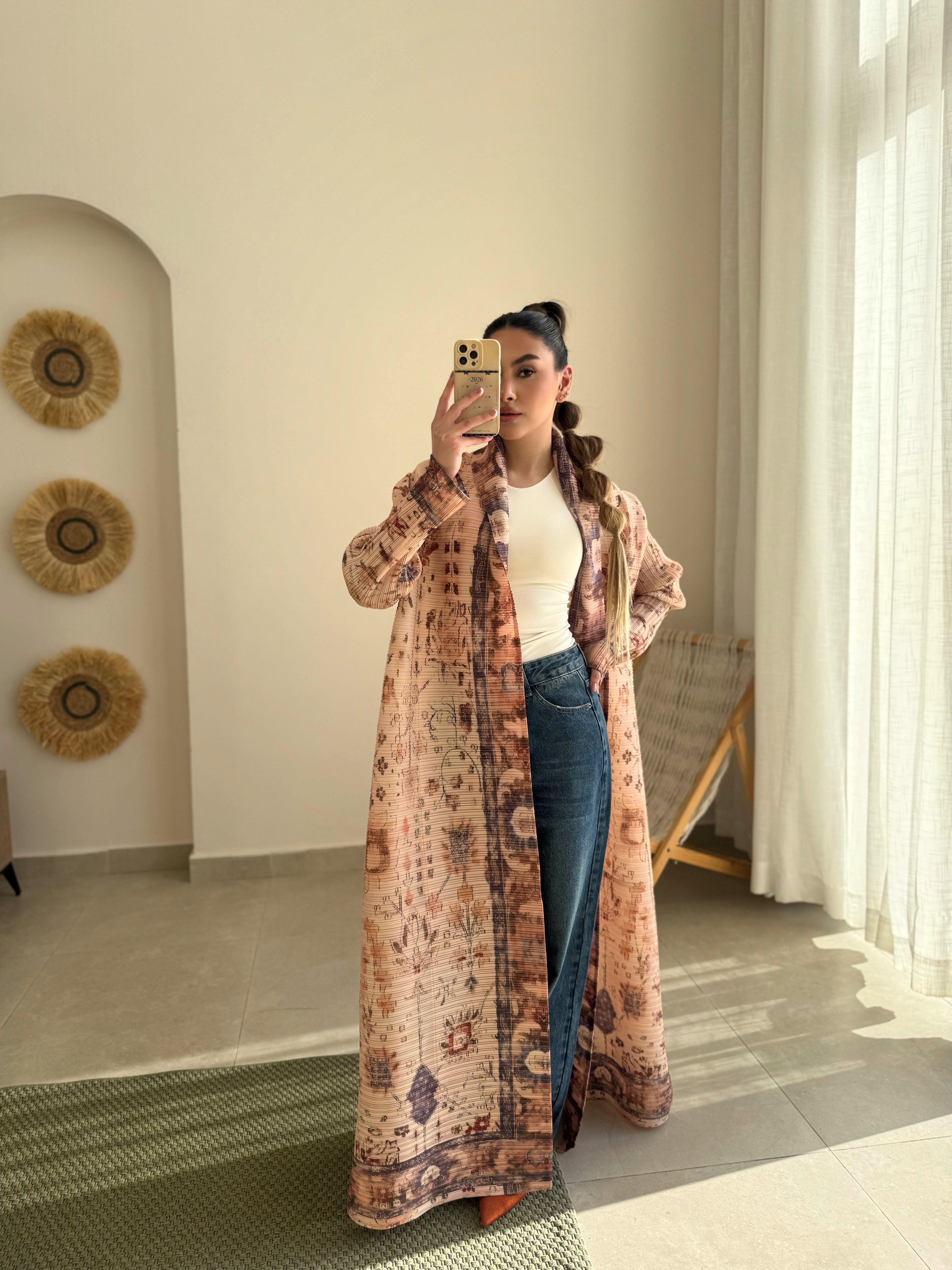 Beige and brown patterned abaya with a tied waist