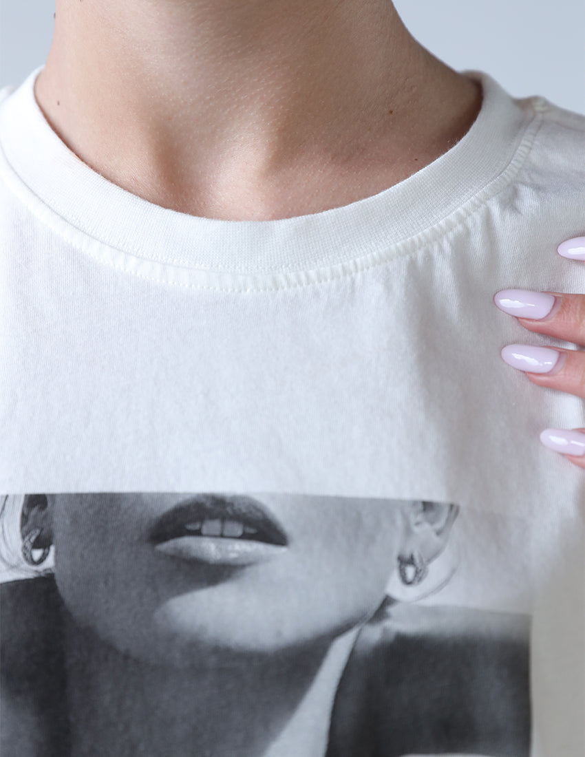 T-shirt with a print of a girl with words.