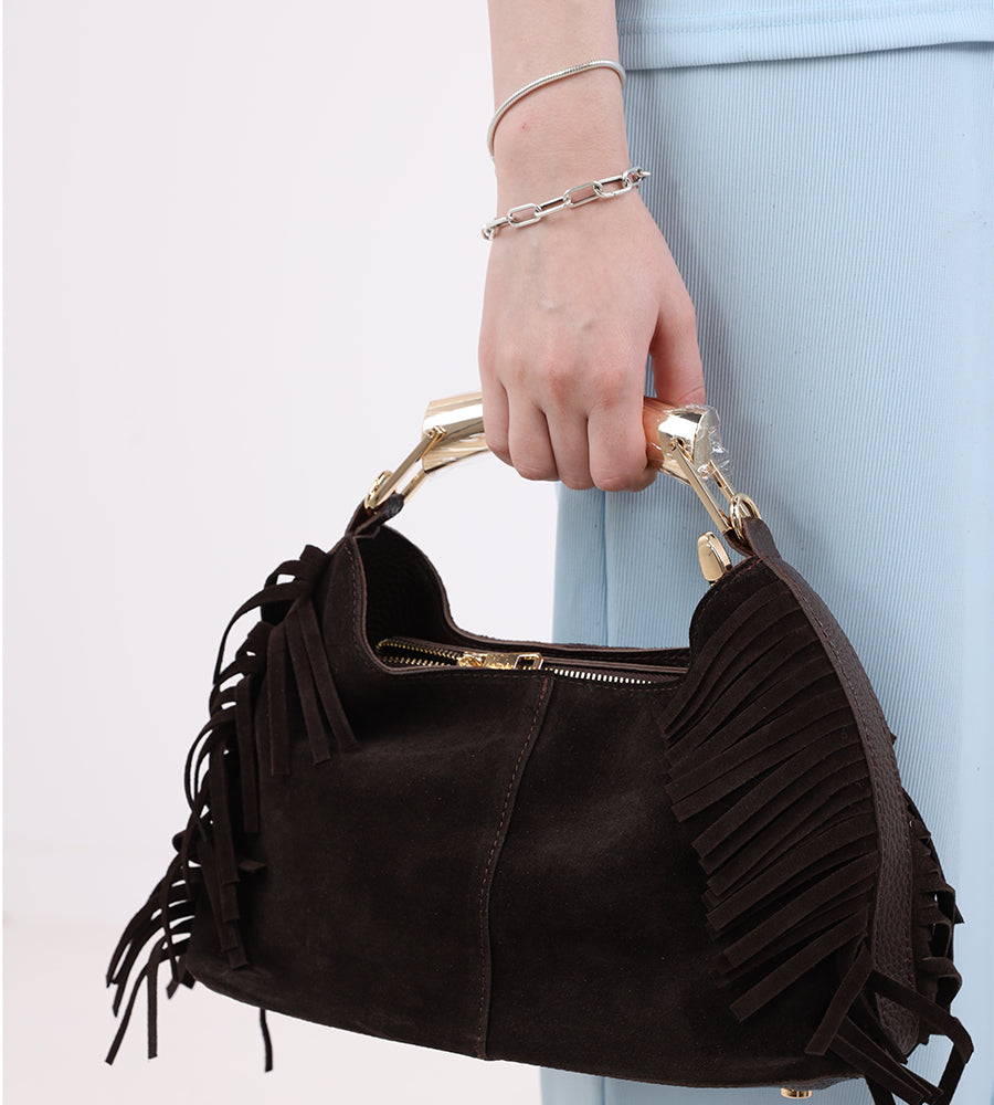Suede bag with fringed edges and a gold handle
