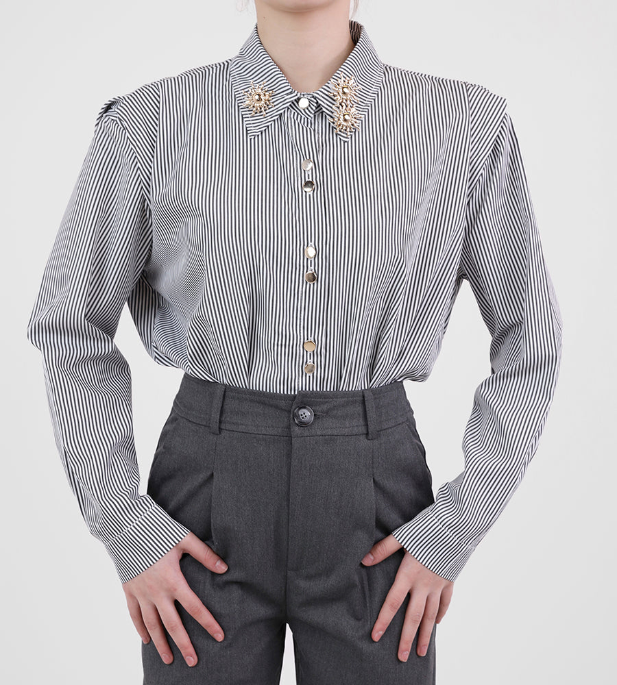 Striped shirt with sun brooch