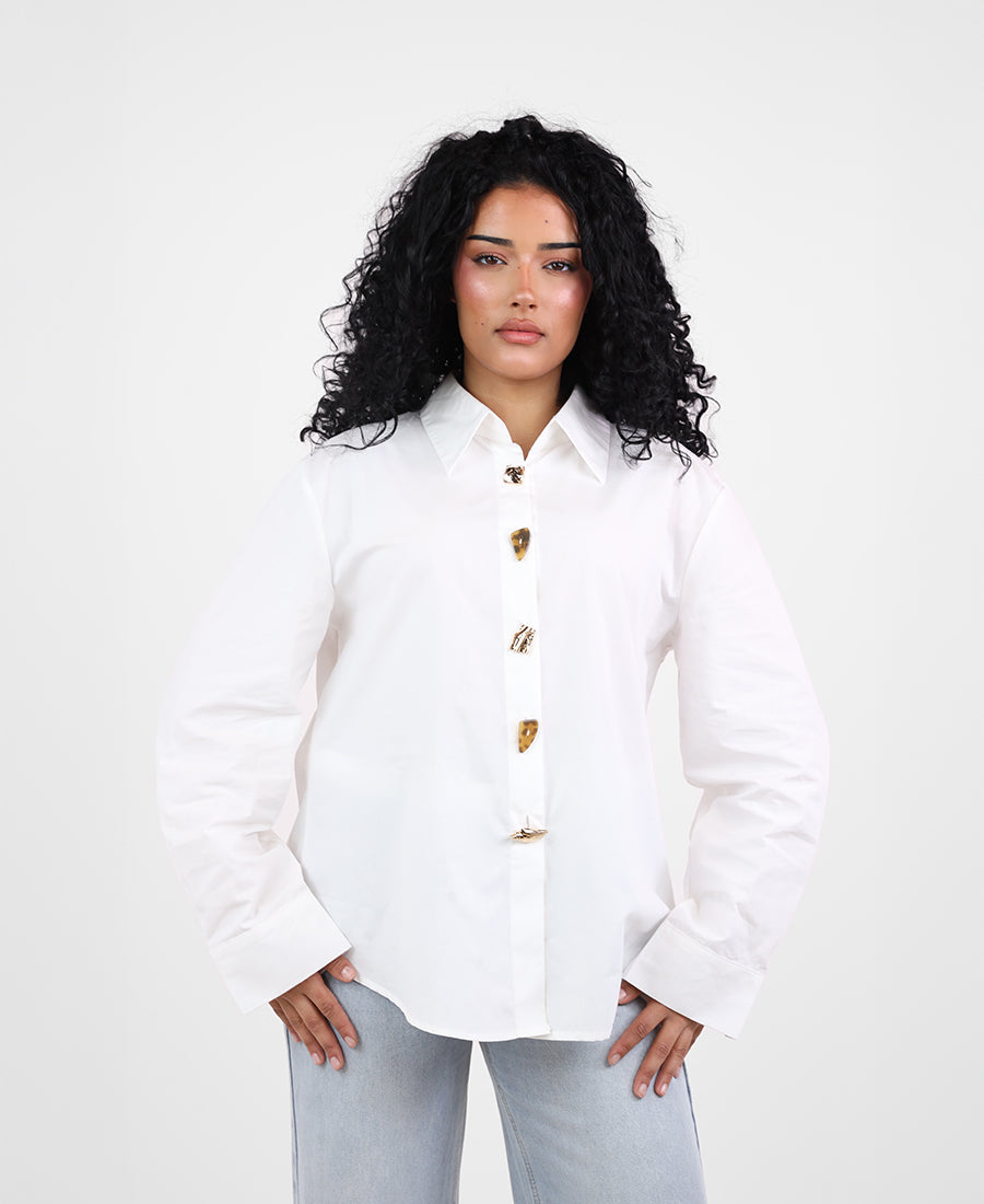 Shirt with assorted buttons and gold trim
