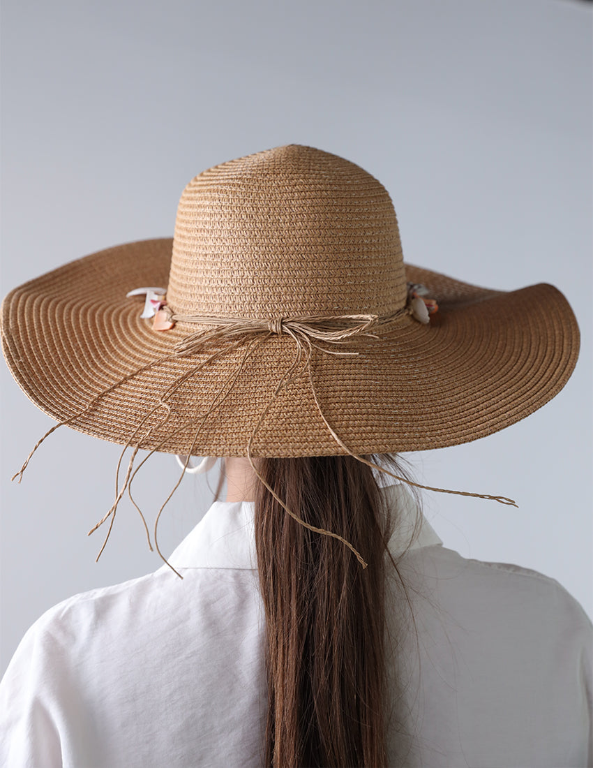 Dark beige priest's hat with a seashell tie