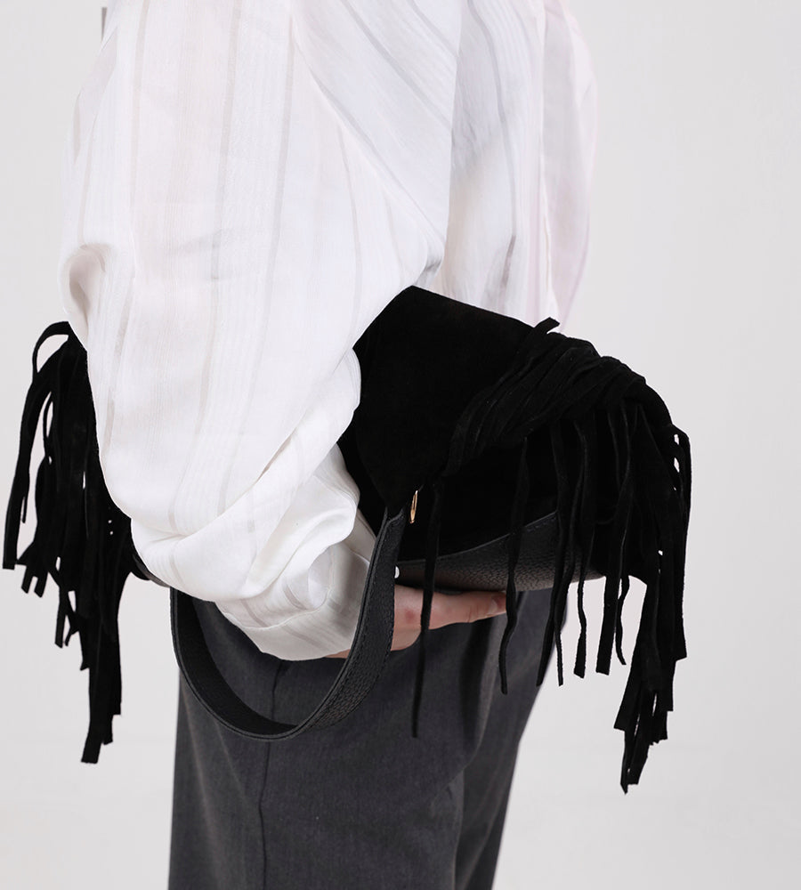 Suede leather handbag with side tassels