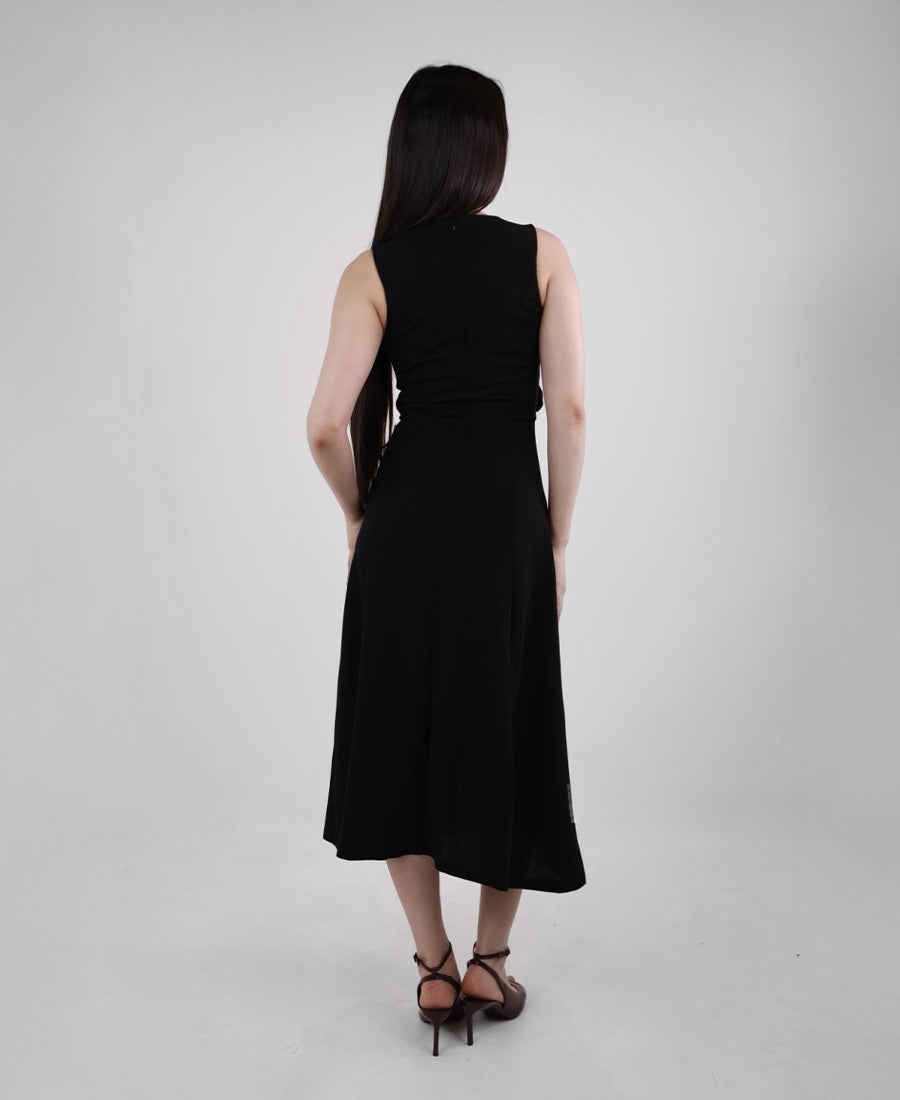 Long black dress with buttons and a gold belt
