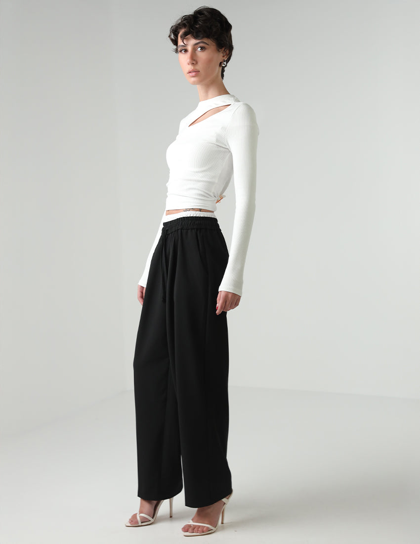 Black straight-cut pants with a white elastic waistband