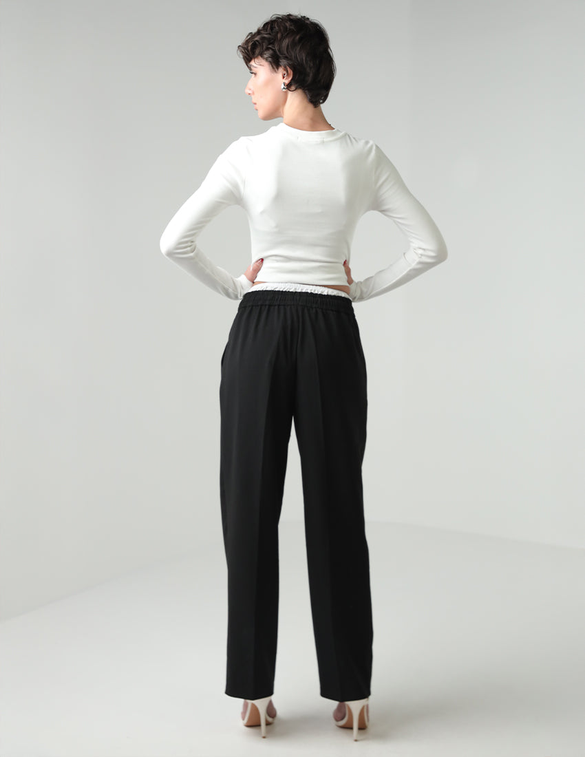 Black straight-cut pants with a white elastic waistband