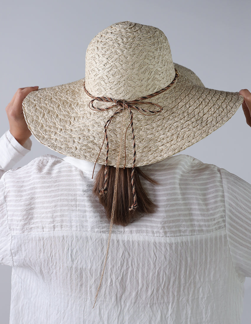 Beige priest's hat with eye patch
