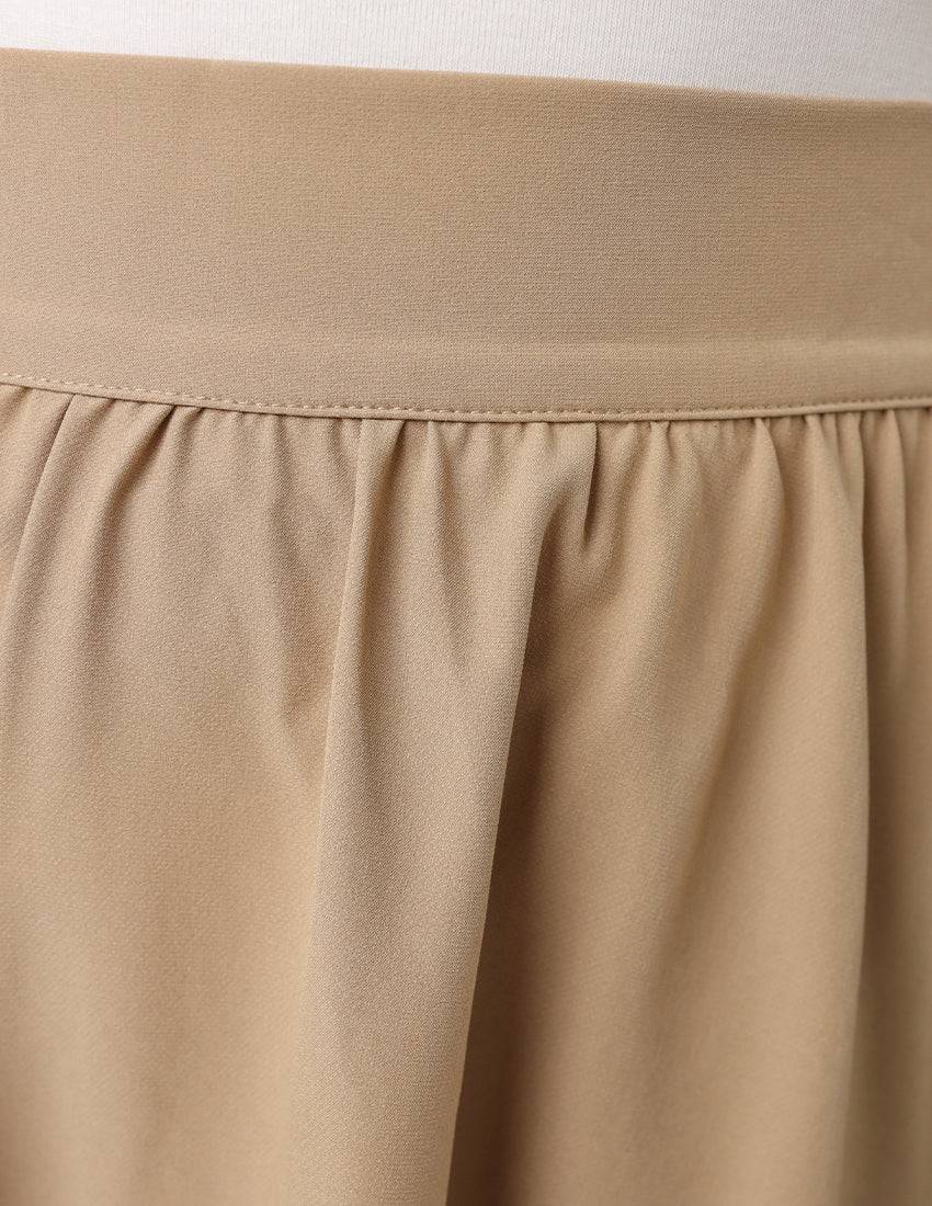 Long pleated beige skirt