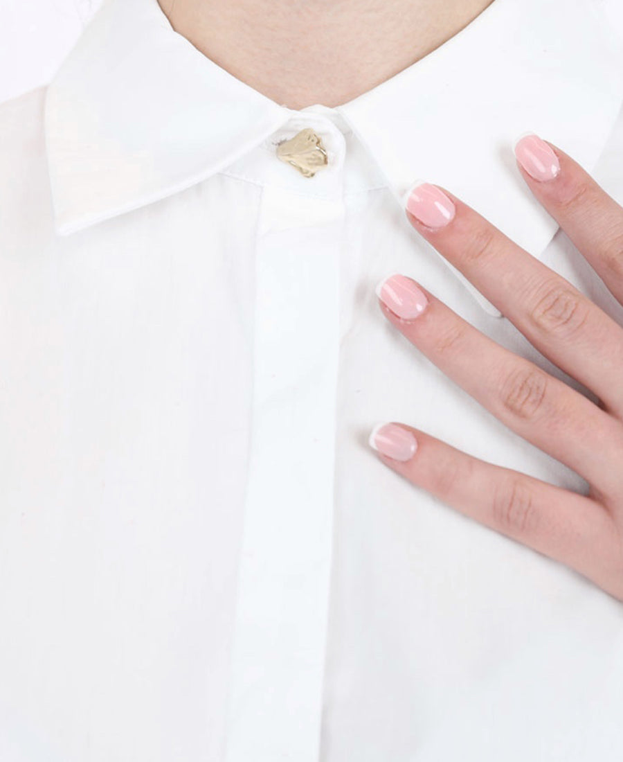 White shirt tied at the waist