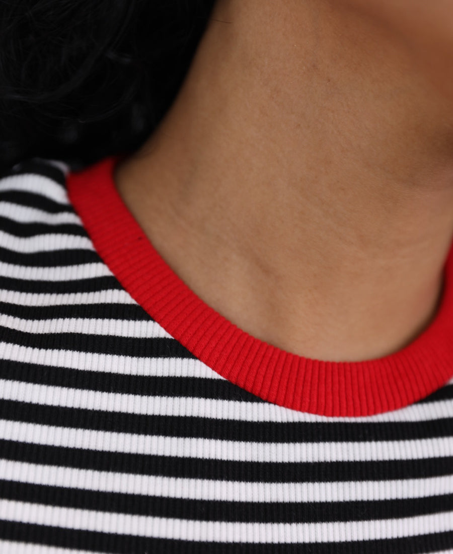 Black and white striped T-shirt with red trim