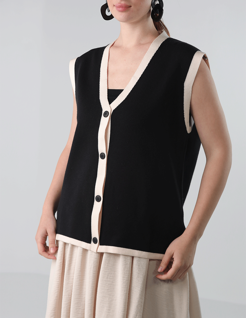 Oversized black wool vest with beige sides