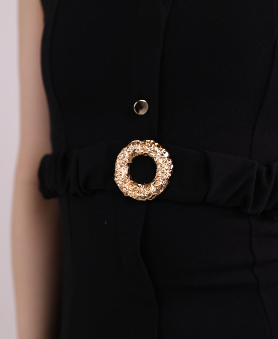 Long black dress with buttons and a gold belt