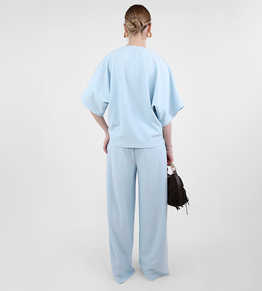 Short-sleeved blouse with gold buttons and trousers set