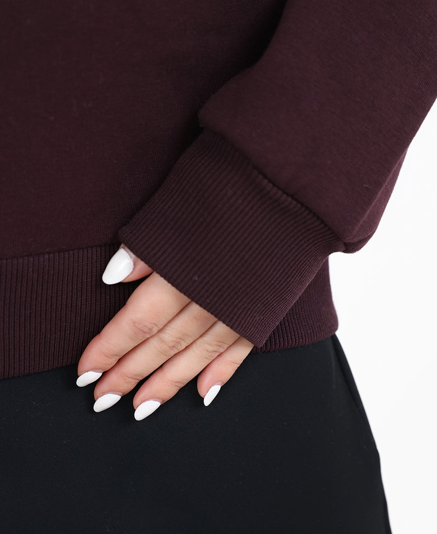 Maroon sweater with printed words