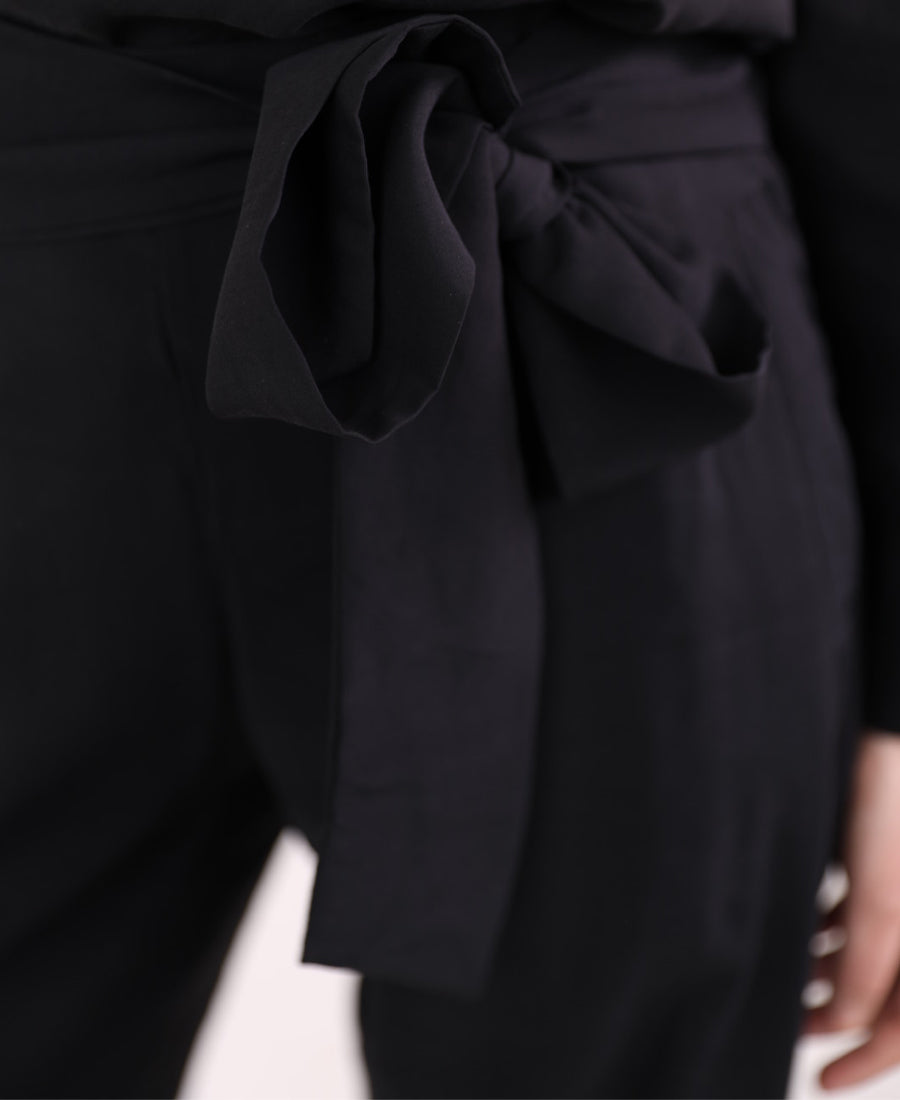 Black set of blouse with tie shoulder buttons and wide leg pants with tie waist
