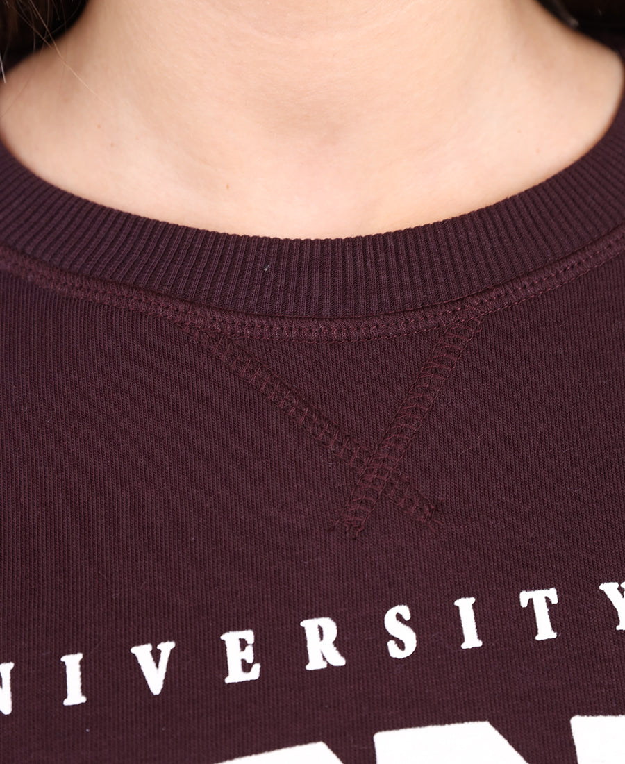 Maroon sweater with printed words