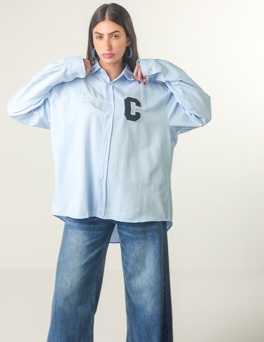 Oversized light blue shirt with the word "C" printed on it