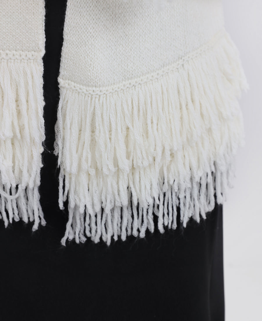 Knitted blouse with tassels