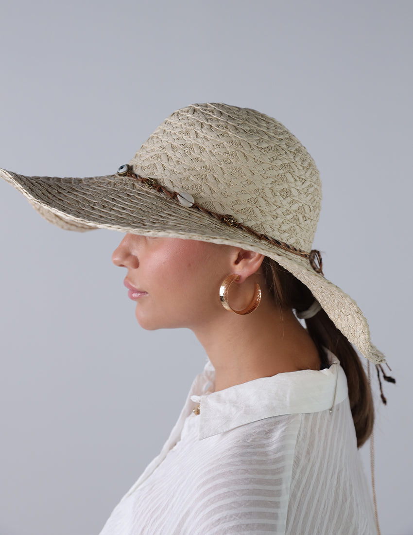 Beige priest's hat with eye patch