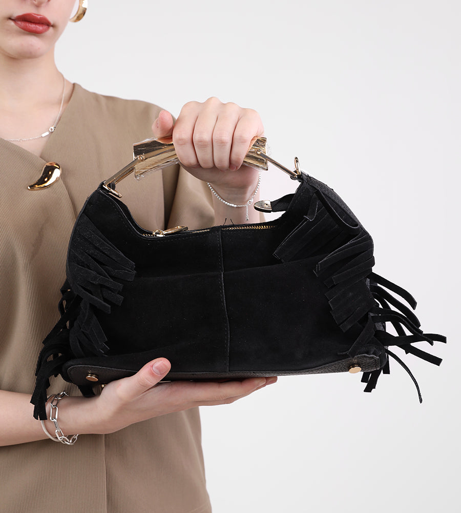 Suede bag with fringed edges and a gold handle