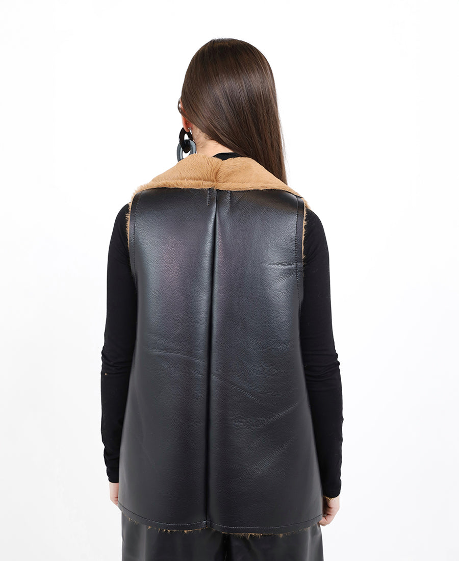 Leather vest on the outside and fur on the inside