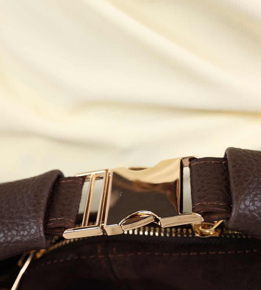 Small suede handbag with a gold buckle