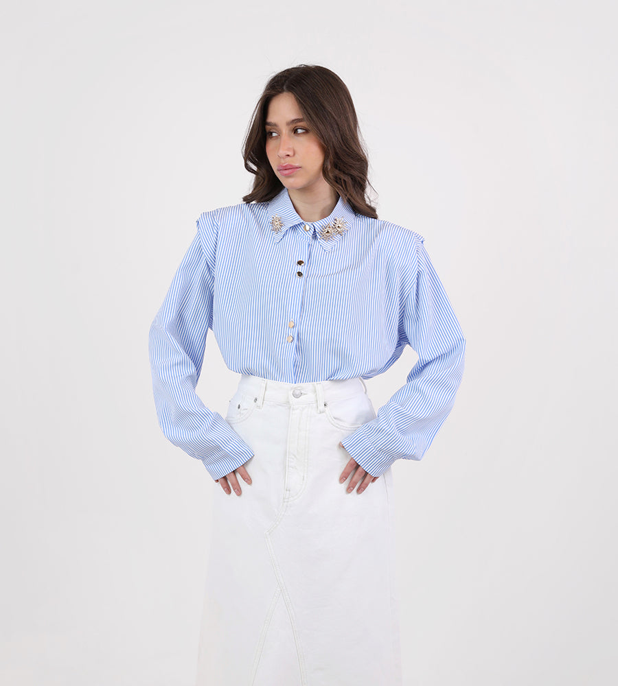 Striped shirt with sun brooch