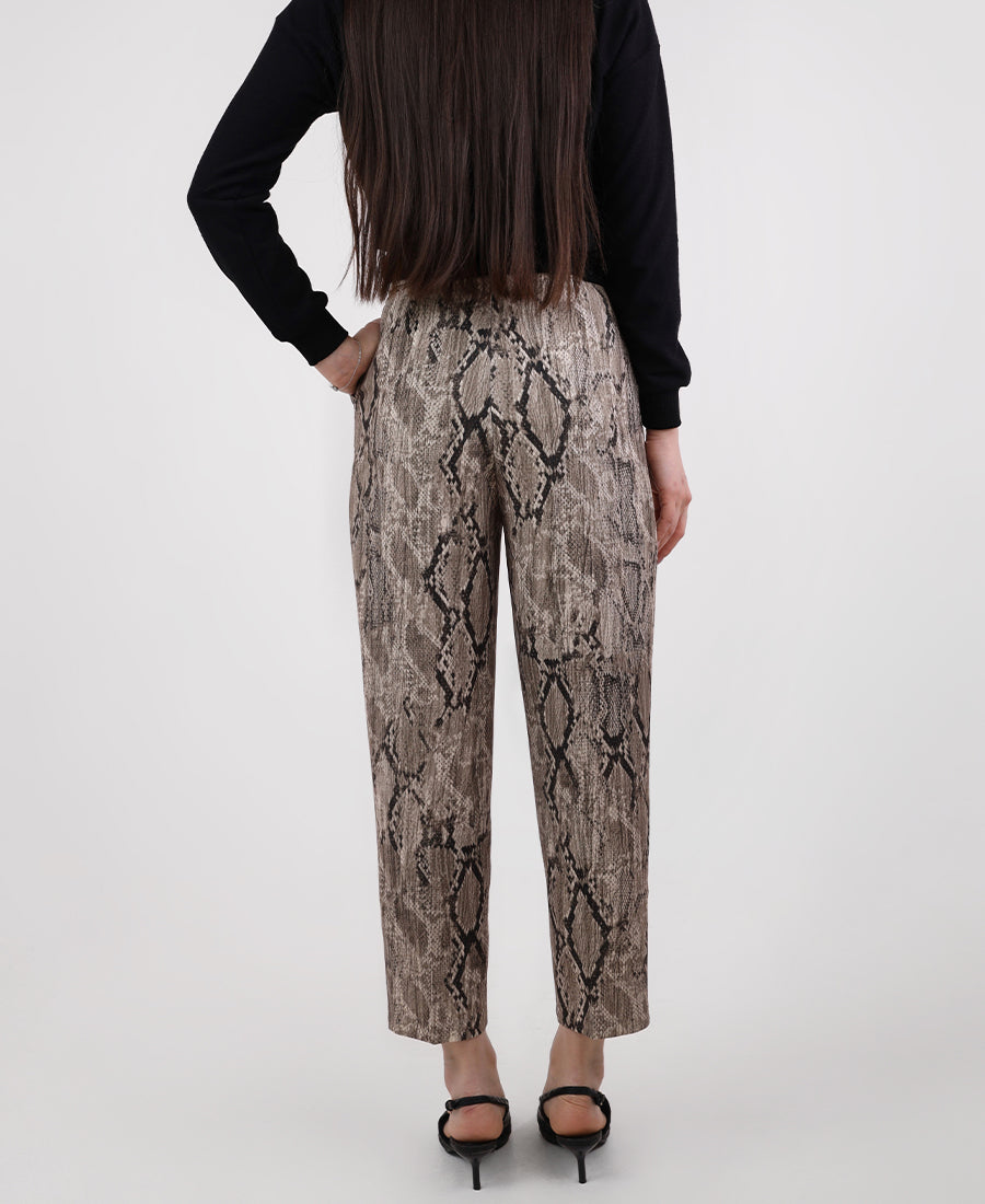 High-waisted snakeskin pants with a belt