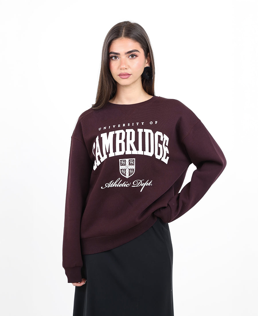 Maroon sweater with printed words