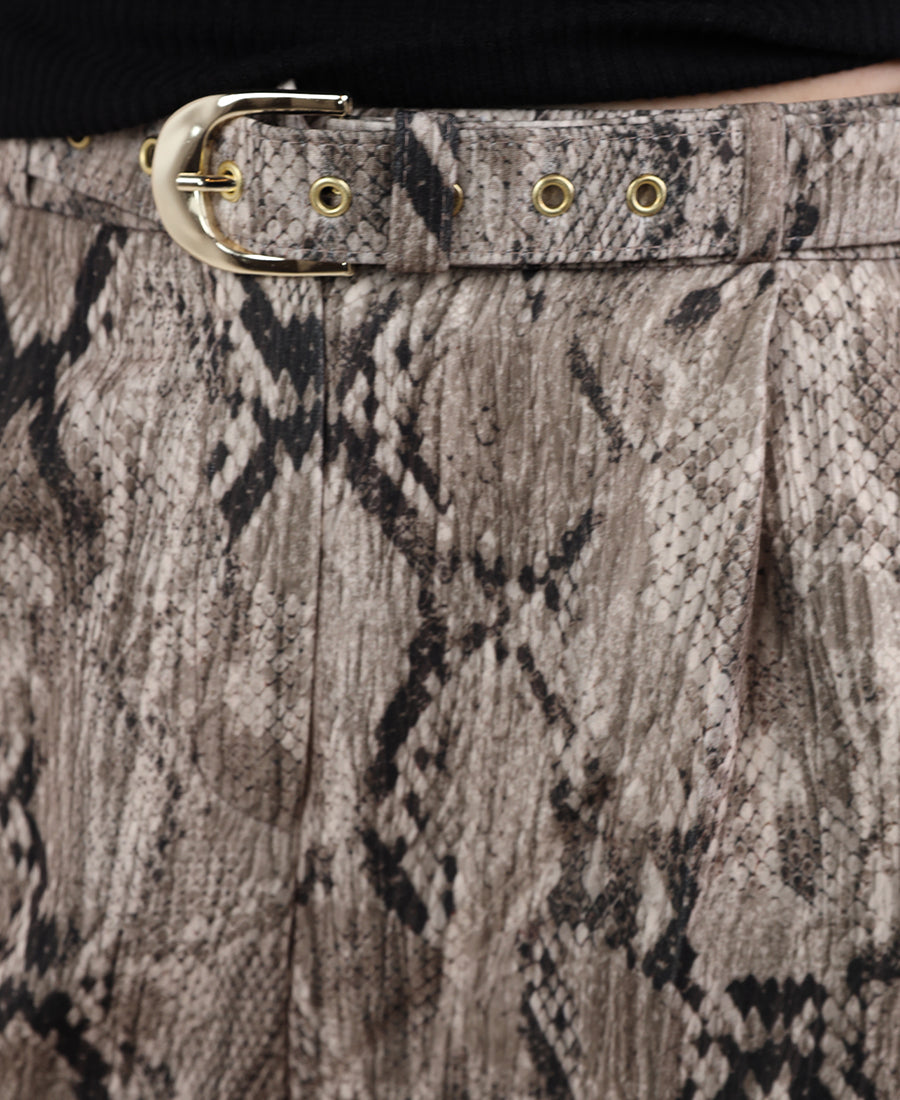High-waisted snakeskin pants with a belt