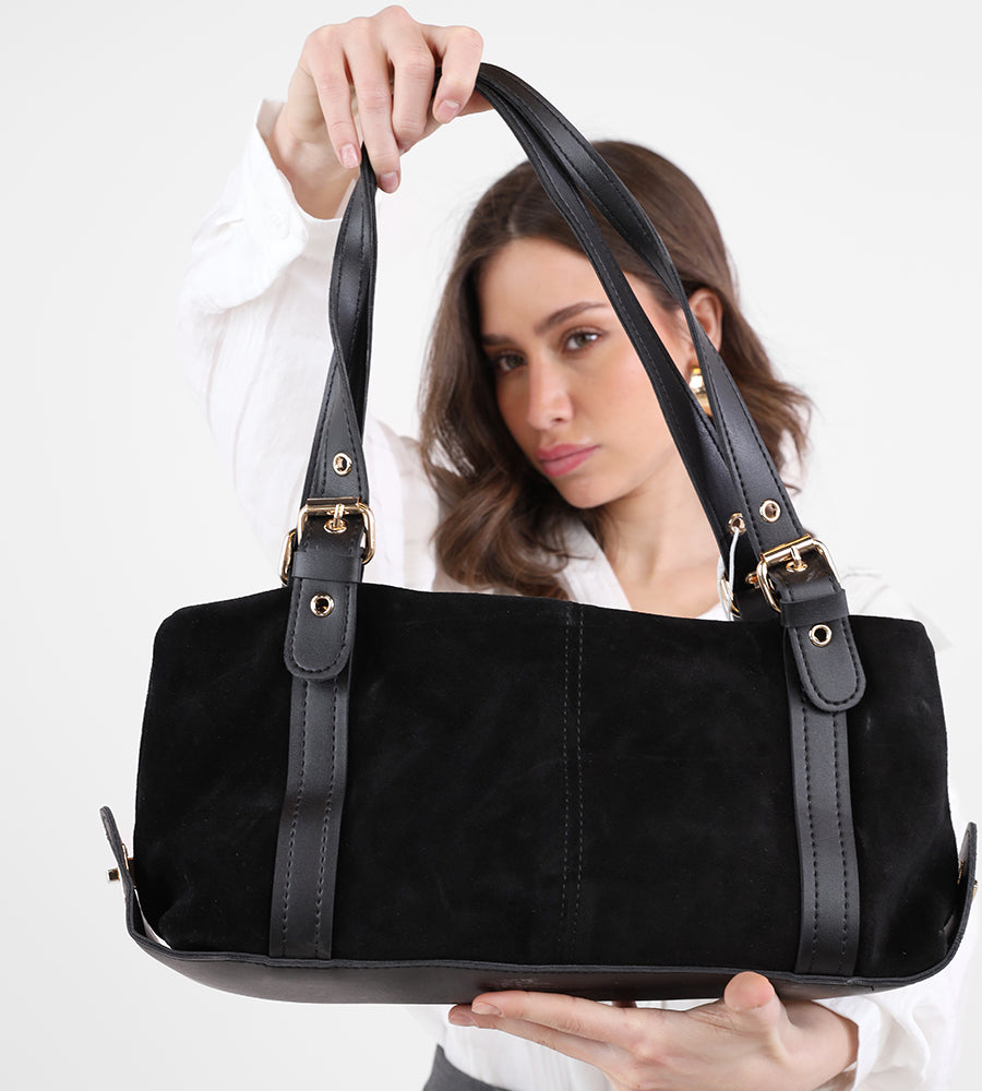 Rectangular suede handbag with a leather strap and gold accents.