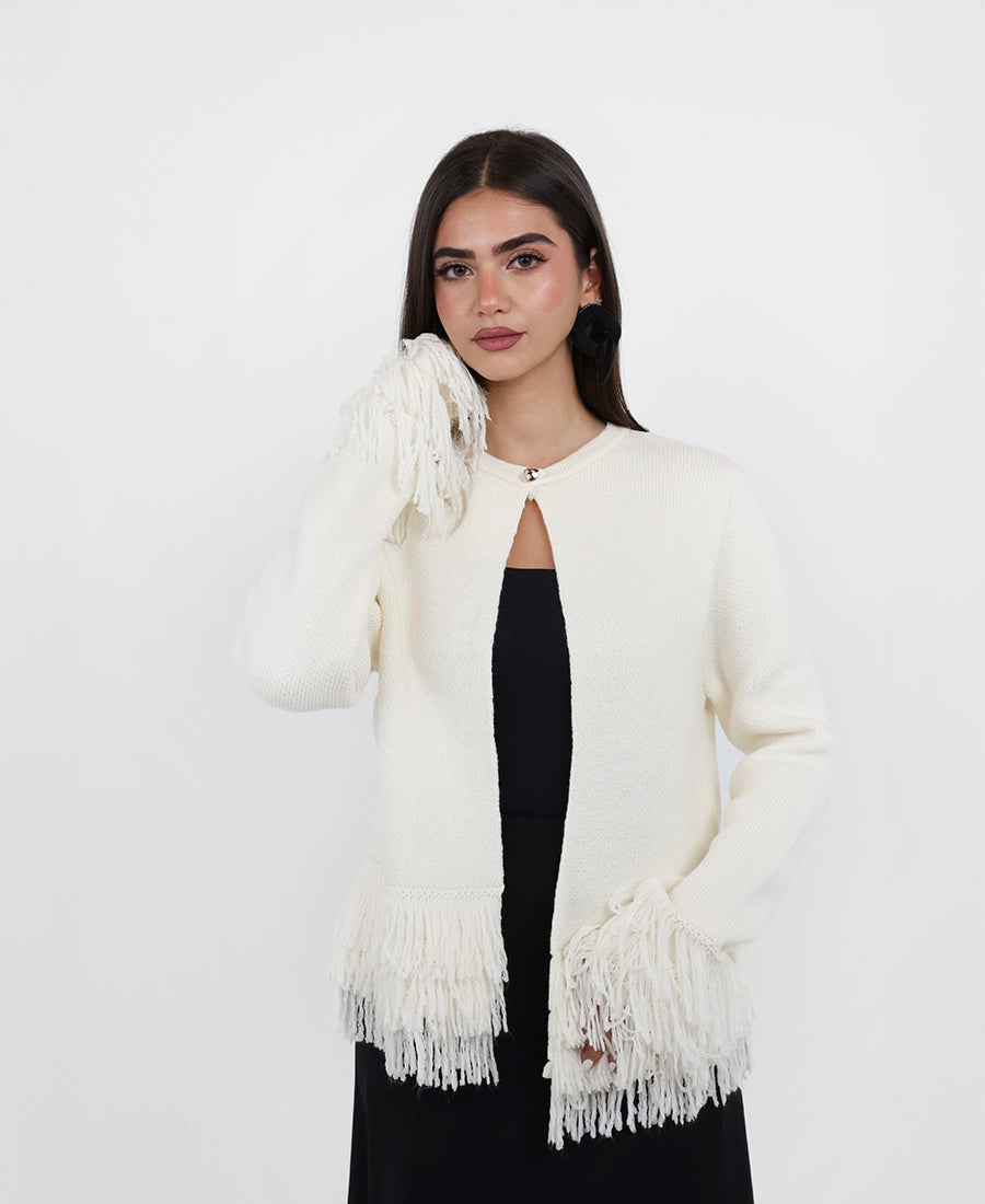 Knitted blouse with tassels