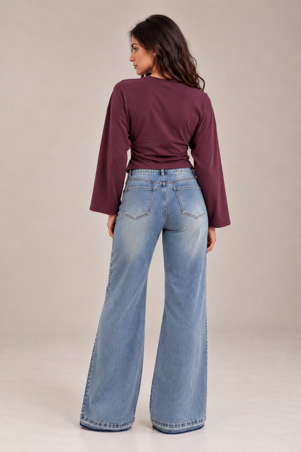 Sky blue flare jeans with a darker gradient at the bottom of the leg