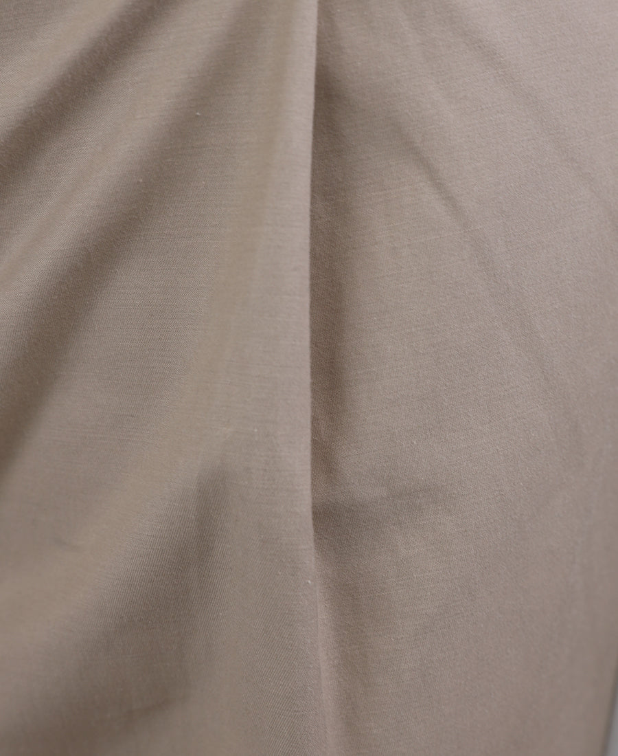 Beige trousers with black stripes on the sides