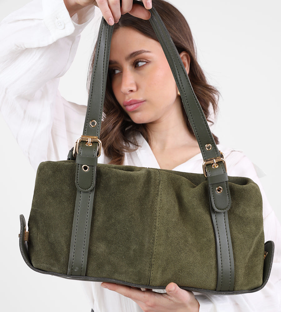 Rectangular suede handbag with a leather strap and gold accents.