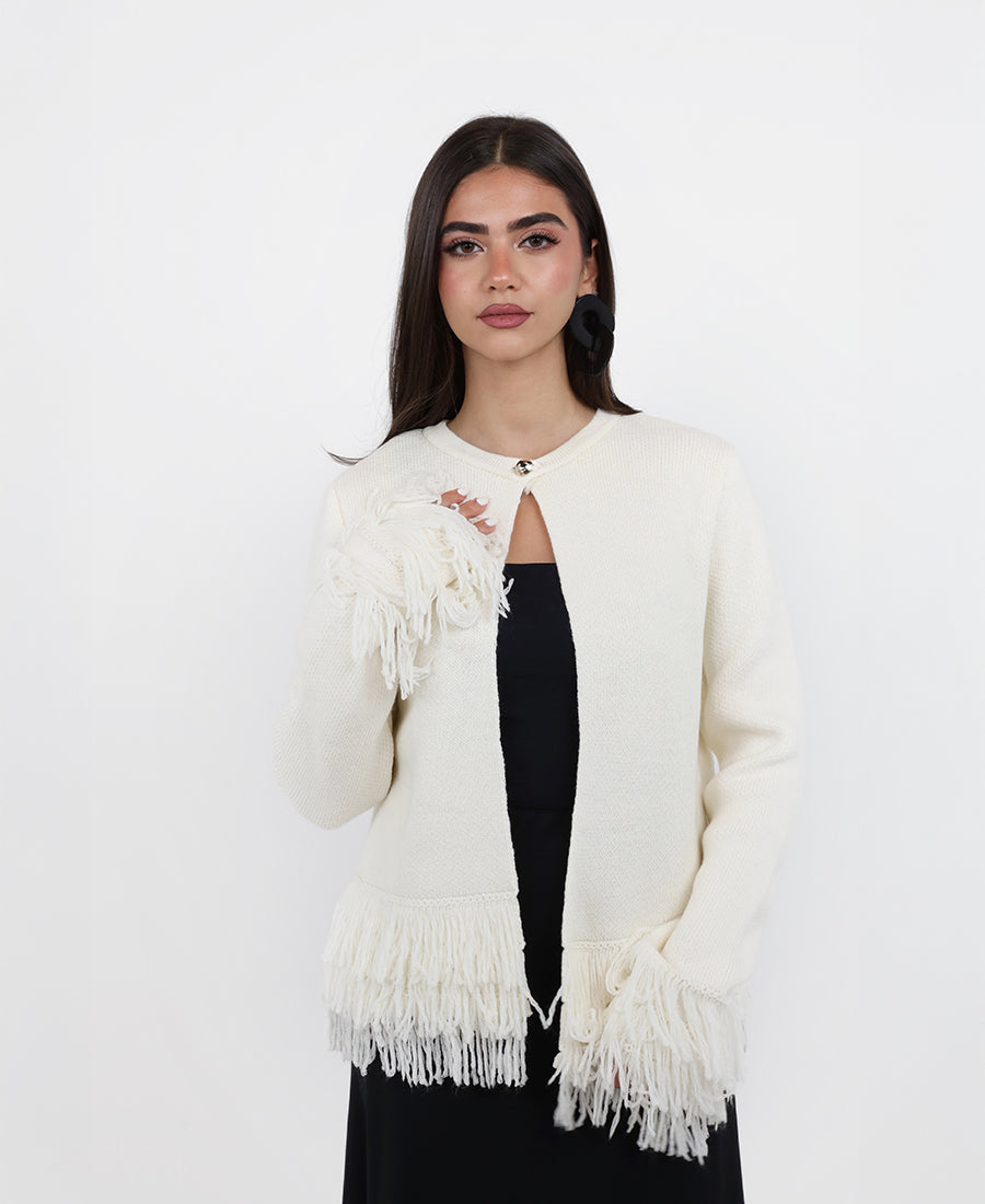 Knitted blouse with tassels