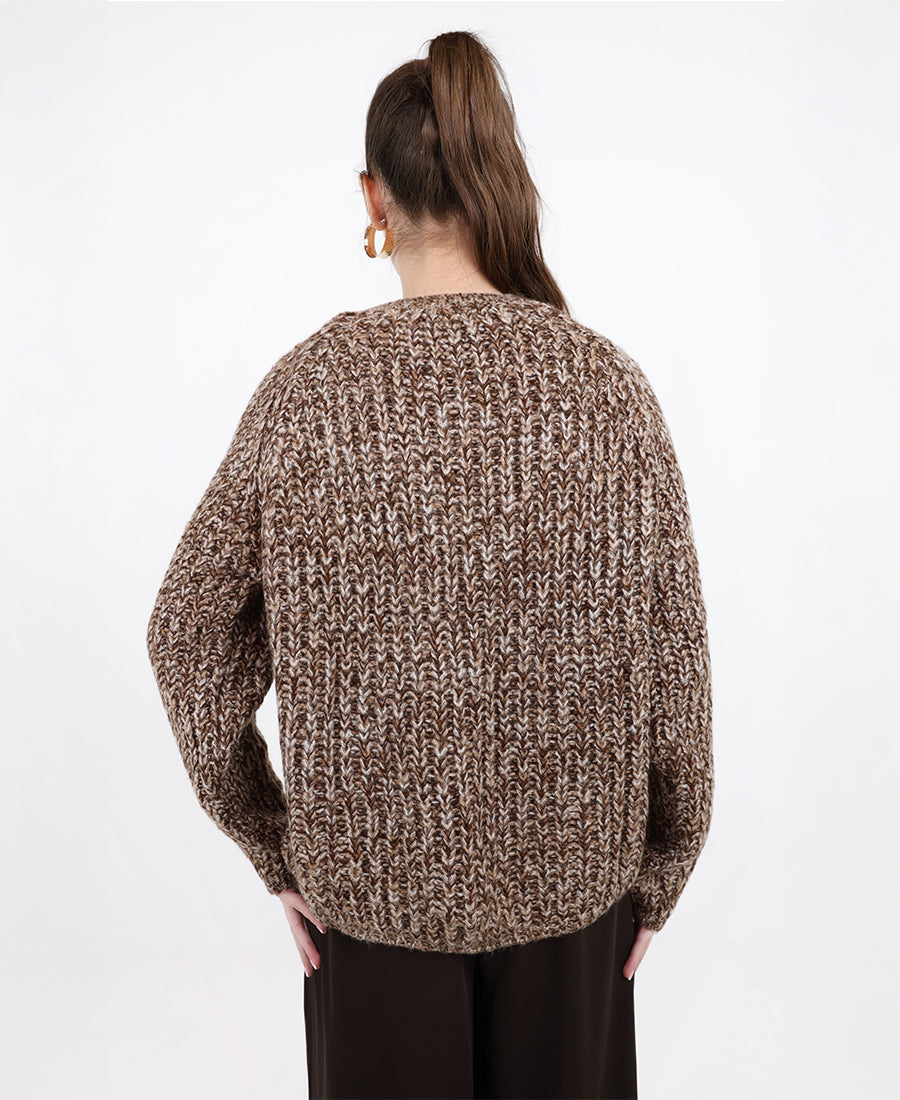 A chunky, multi-colored marl knit sweater